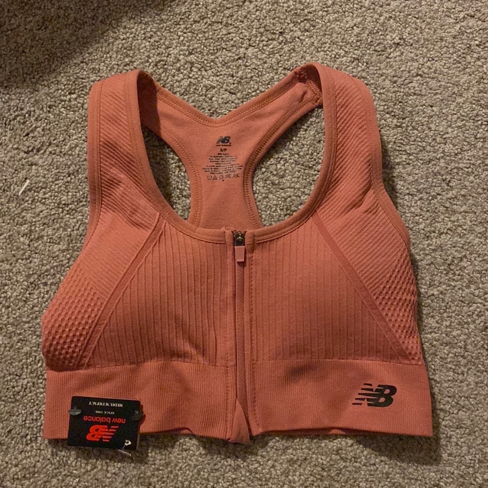 New Balance dull pink sports bra that’s never been worn but really good material
